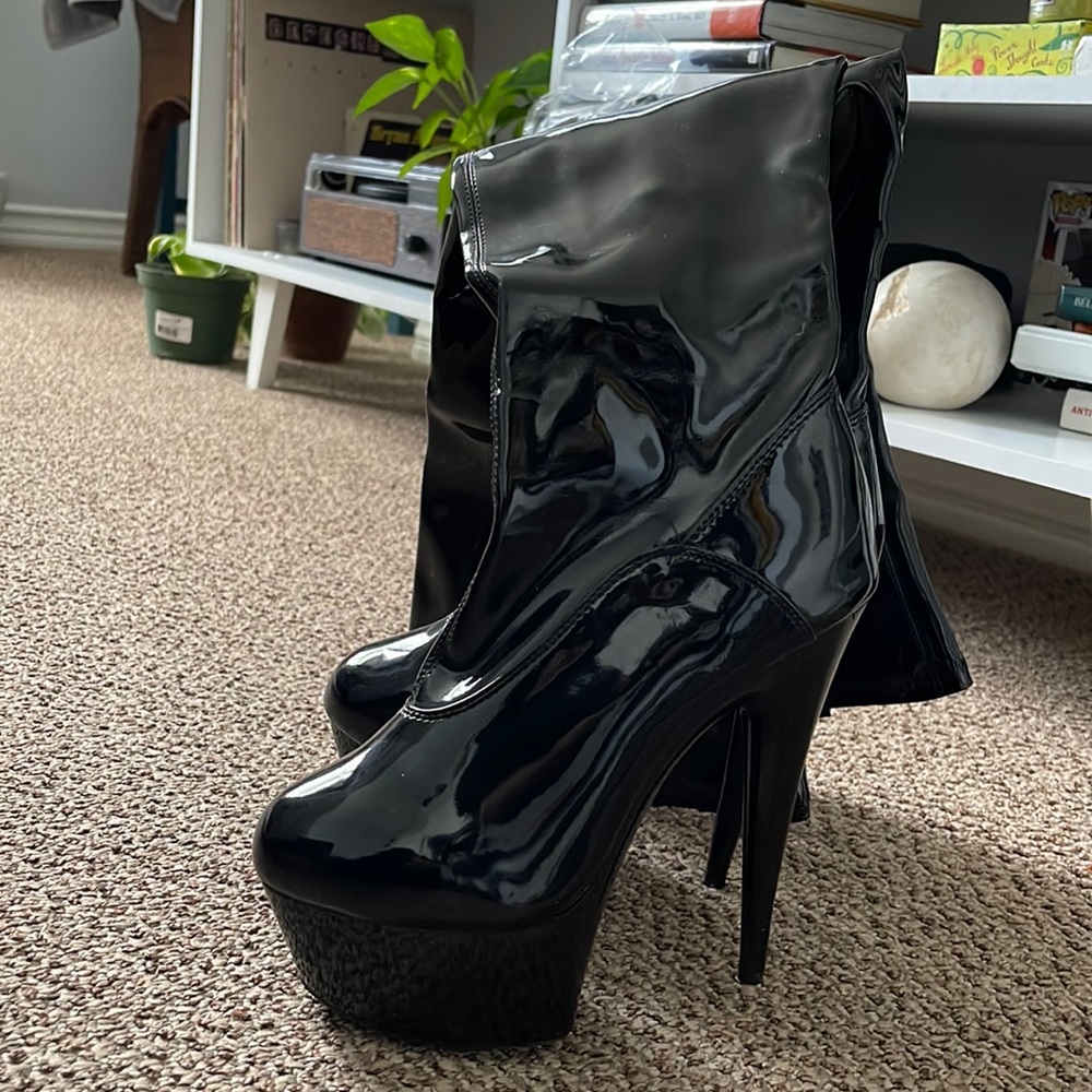 Black platform patent leather boots.